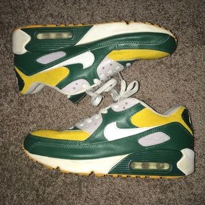Green, gold, and white Nike Air Max